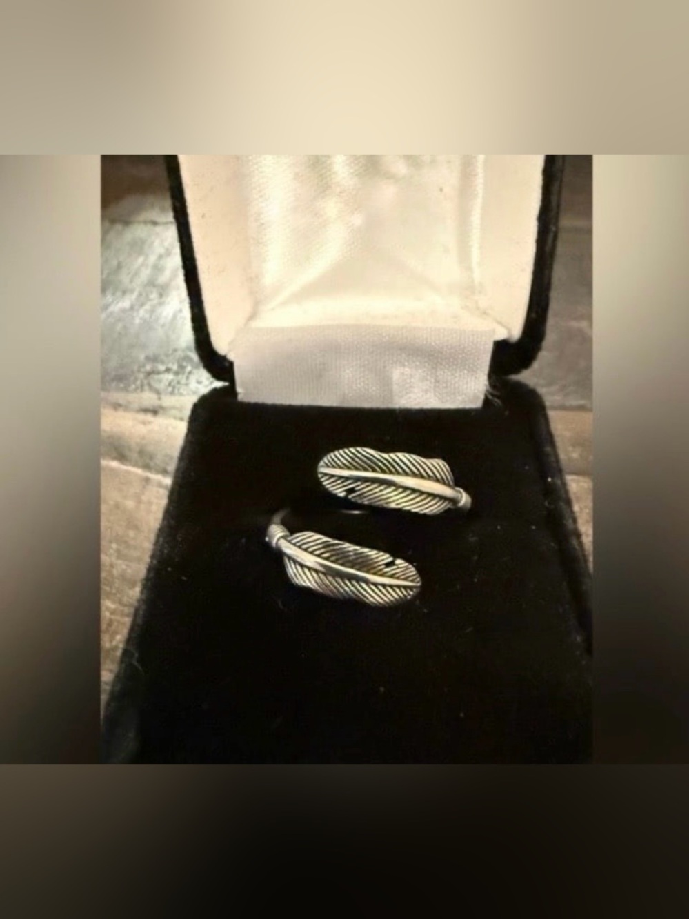 This 925 Sterling Silver Feather Ring is adjustable and can fit sizes 6, 7, or 8